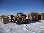 Pallets of  excess and obsolete materials are placed in position outside the National Science Foundation's Amundsen-Scott Station at the South Pole in January 2016. A team of three New York Air National Guard Airmen built 73 pallets in 11 days so the unneeded items can be hauled away later this year.