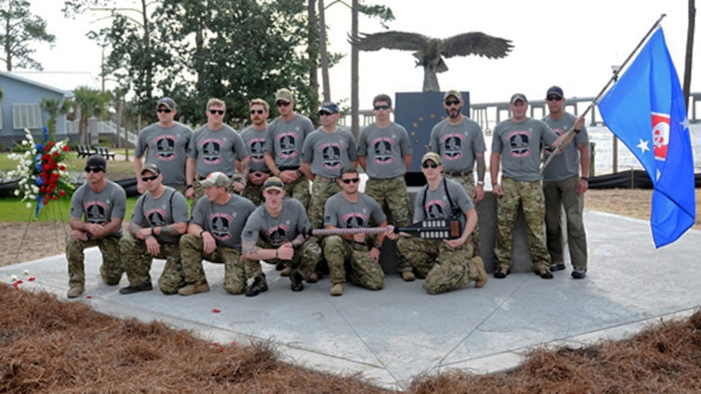 15 Marines pose for a photo before starting a 770-mile ruck from Navarre, Florida, to Marine Corps Base Camp Lejeune, North Carolina to honor 11 service members who died in a helicopter crash one year ago. Seven of the fallen were their fellow Marines, now known as the Raider 7. The march is meant as a test of physical and mental stamina that’s second nature to Marines.