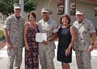 TAMPA, Fla. – Master Sgt. Adrian M. Marquez Ayala is presented the Purple Heart medal by Lieutenant. Gen. William D. Beydler Mar. 17, 2016, at a ceremony MacDill Air Force Base, Fla. Marquez received the Purple Heart for injuries he sustained on 8 November 2004, during Operation PHANTOM FURY in Fallujah, Iraq. Marquez is currently assigned to Wounded Warrior Battalion, Tampa Detachment. Beydler is the Commanding General of Marine Corps Forces Central Command.