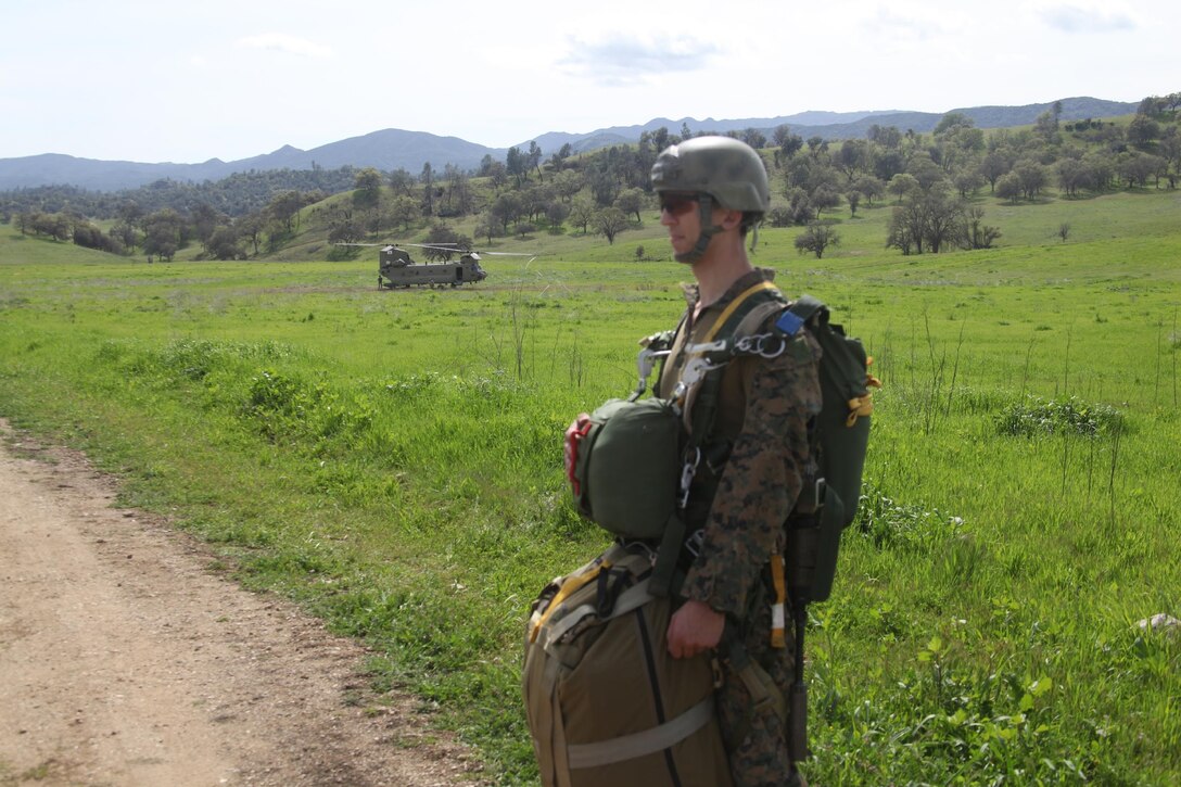 Sgt. Andrew Liss, an assistant reconnaissance team leader with 4th Force Reconnaissance Company, 4th Marine Division, Marine Forces Reserve, prepares to load a CH-47 helicopter with affixed combat equipment at Drop Zone Linus at Fort Hunter Liggett, Calif., March 8-12, 2016. The Marines spent five days improving their reconnaissance mission techniques. (Photo courtesy of 4th Force Recon)