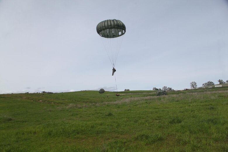 A reconnaissance Marine with 4th Force Reconnaissance, 4th Marine Division, Marine Forces Reserve, prepares to land an MC-7 Parachute with combat equipment at Drop Zone Linus at Fort Hunter Liggett, Calif., March 8-12, 2016. The parachute training enabled the Marines to maintain their proficiency with the MC-7 parachute system. (Photo courtesy of 4th Force Recon)