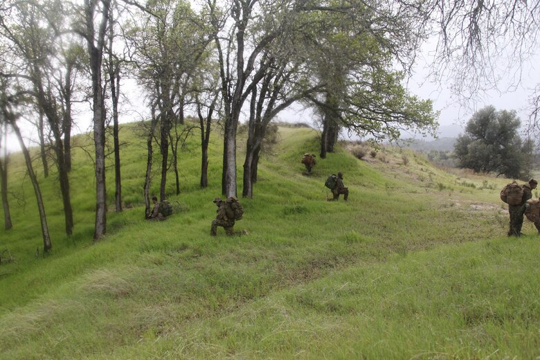 A reconnaissance team with 4th Force Reconnaissance Company, 4th Marine Division, Marine Forces Reserve, prepares to conduct a long range patrol movement to an observation post at Fort Hunter Liggett, Calif., March 8-12, 2016. The Marines conducted surveillance, patrolling and land navigation along their route to the observation post. (Photo courtesy of 4th Force Recon)