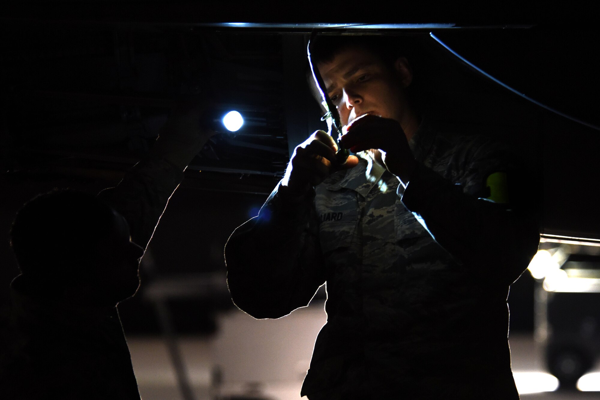 Staff Sgt. James Hilliard, and Airman 1st Class Jarel Orr, both 4th Aircraft Maintenance Squadron avionics technicians, troubleshoots an actuator on an F-15E Strike Eagle March 9, 2016, at Nellis Air Force Base, Nevada. Airmen from Seymour Johnson Air Force Base, North Carolina traveled to Nellis AFB to participate in Red Flag 16-2, a two-week exercise integrating joint-service and allied partners to enhance warfighting capabilities. (U.S. Air Force photo/Staff Sgt. Chuck Broadway)