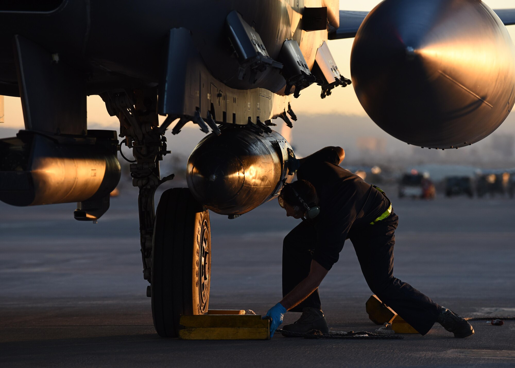 An crew chieff assigned to the 336th Aircraft Maintenance Squadron at Seymour Johnson Air Force Base, North Carolina, secures an F-15E Strike Eagle Feb. 26, 2016 during Red Flag 16-2 at Nellis Air Force Base, Nevada. Strike Eagle airrews and maintainers participated in the two-week, large-force exercise to enhance warfighting skills along with joint and allied interoperability. (U.S. Air Force photo/Staff Sgt. Michael Charles)