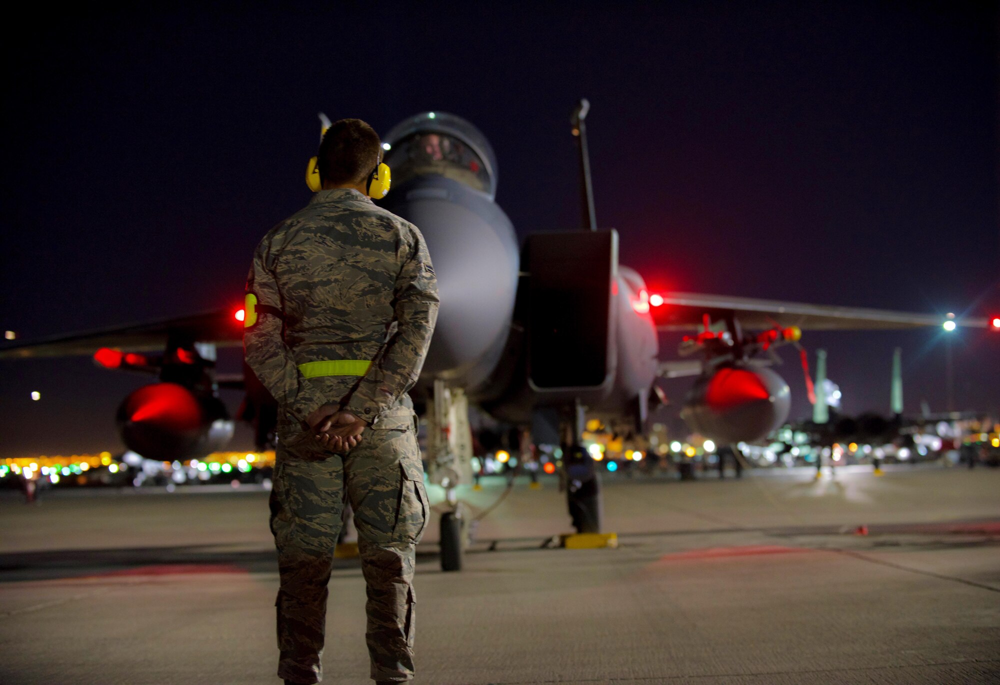 Two crew chiefs assigned to the 336th Aircraft Maintenance Squadron at Seymour Johnson Air Force Base, North Carolina, perform an engine test on an F-15E Strike Eagle March 9, 2016 during Red Flag 16-2 at Nellis Air Force Base, Nevada. Strike Eagle aircrew and maintainers participated in the two-week, large-force exercise to enhance warfighting skills along with joint and allied interoperability. (U.S. Air Force photo/Staff Sgt. Michael Charles)