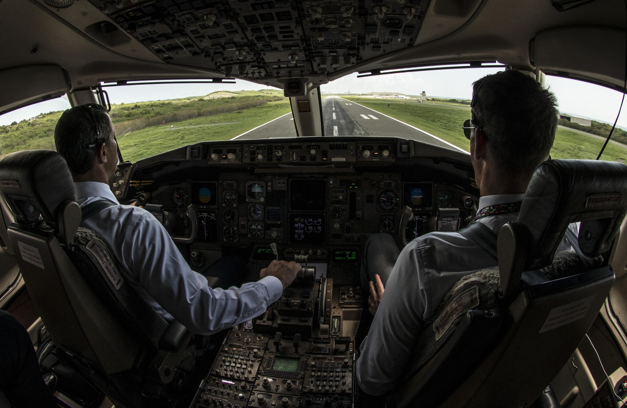 Lt. Cols. Jeffrey Smitley and Mark Scheer, both 1st Airlift Squadron pilots, land a C-32A Executive Transport at Henry E. Rohlsen Airport, St. Croix, Virgin Islands, Sept. 21, 2015. The 1st AS crew flew an off-station trainer there and to other locations to familiarize new pilots, communication systems operators, flight attendants and flying crew chiefs. (U.S. Air Force photo/Senior Master Sgt. Kevin Wallace)