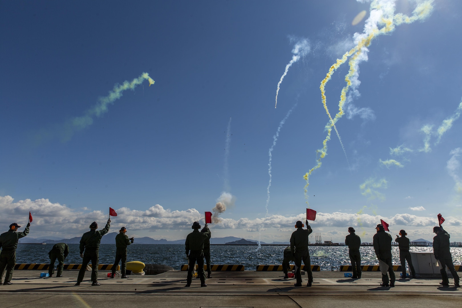 Japan Maritime Self-Defense Force aviators conduct flare-gun training during Winter Survival Training at Marine Corps Air Station Iwakuni, Japan, March 9-11, 2016. Mandatory for all aviators and aircrew, the JMSDF conducts this training semi-annually, once in the summer and once in the winter. JMSDF members started the training by firing off a flare-gun and a pencil-gun, which is a smaller version of a flare gun. (U.S. Marine Corps photo by Lance Cpl. Aaron Henson/Released)