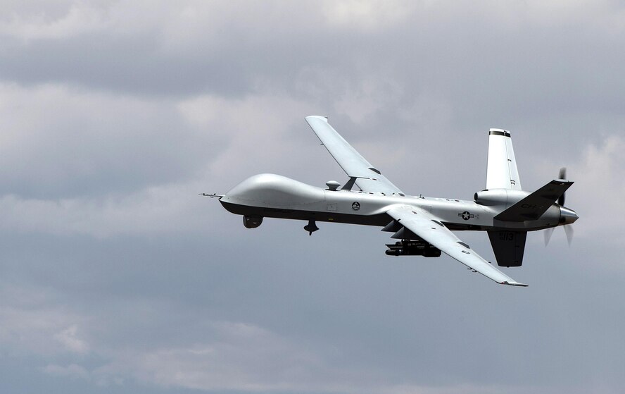 An MQ- Reaper remotely piloted aircraft performs aerial maneuvers over Creech Air Force Base, Nev., June 25, 2015. The MQ-9 Reaper is an armed, multi-mission, medium-altitude, long-endurance remotely piloted aircraft that is employed primarily as an intelligence-collection asset and secondarily against dynamic execution targets. (U.S. Air Force photo by Senior Airman Cory D. Payne/Not Reviewed)