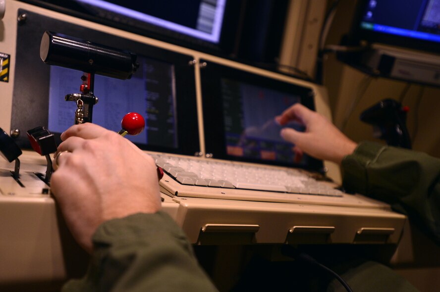 Staff Sgt. Matthew, 432nd Wing sensor operator flies a training mission Oct. 13, 2015, at Creech Air Force Base, Nevada. The 432nd Wing set a record of weapon strikes in July of 2015, and then again in August helping countless U.S. and coalition forces return home to their families. (U.S. Air Force photo by Airman 1st Class Christian Clausen/released)