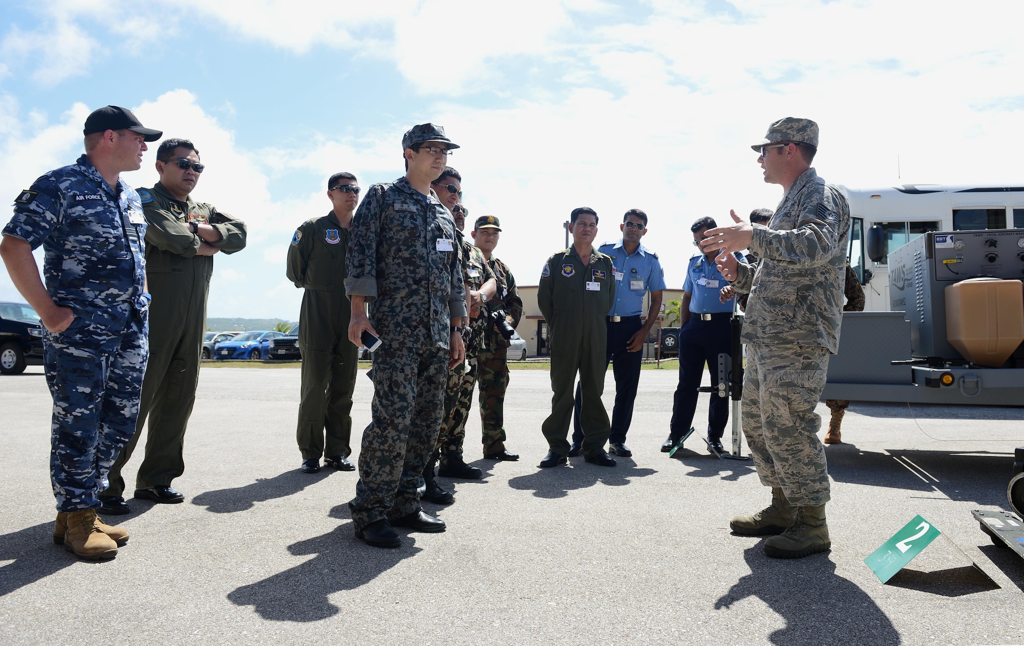 Military logistics and maintenance experts from nine nations discuss the procedures to build a cargo pallet during Pacific Agility 16-1 March 15, 2016, at Andersen Air Force Base, Guam. Pacific Agility is a multilateral U.S. Pacific Agility is a Pacific Air Forces-led engagement focusing on a series of logistics subject-matter expert exchanges designed to increase partner capabilities, military relations and regional stability for the Indo-Asia-Pacific region. The four-day program focused on various topics such as logistics, aircraft maintenance, air/ground transportation, humanitarian assistance/disaster relief and contingency operations. (U.S. Air Force photo by Airman 1st Class Arielle Vasquez/Released)