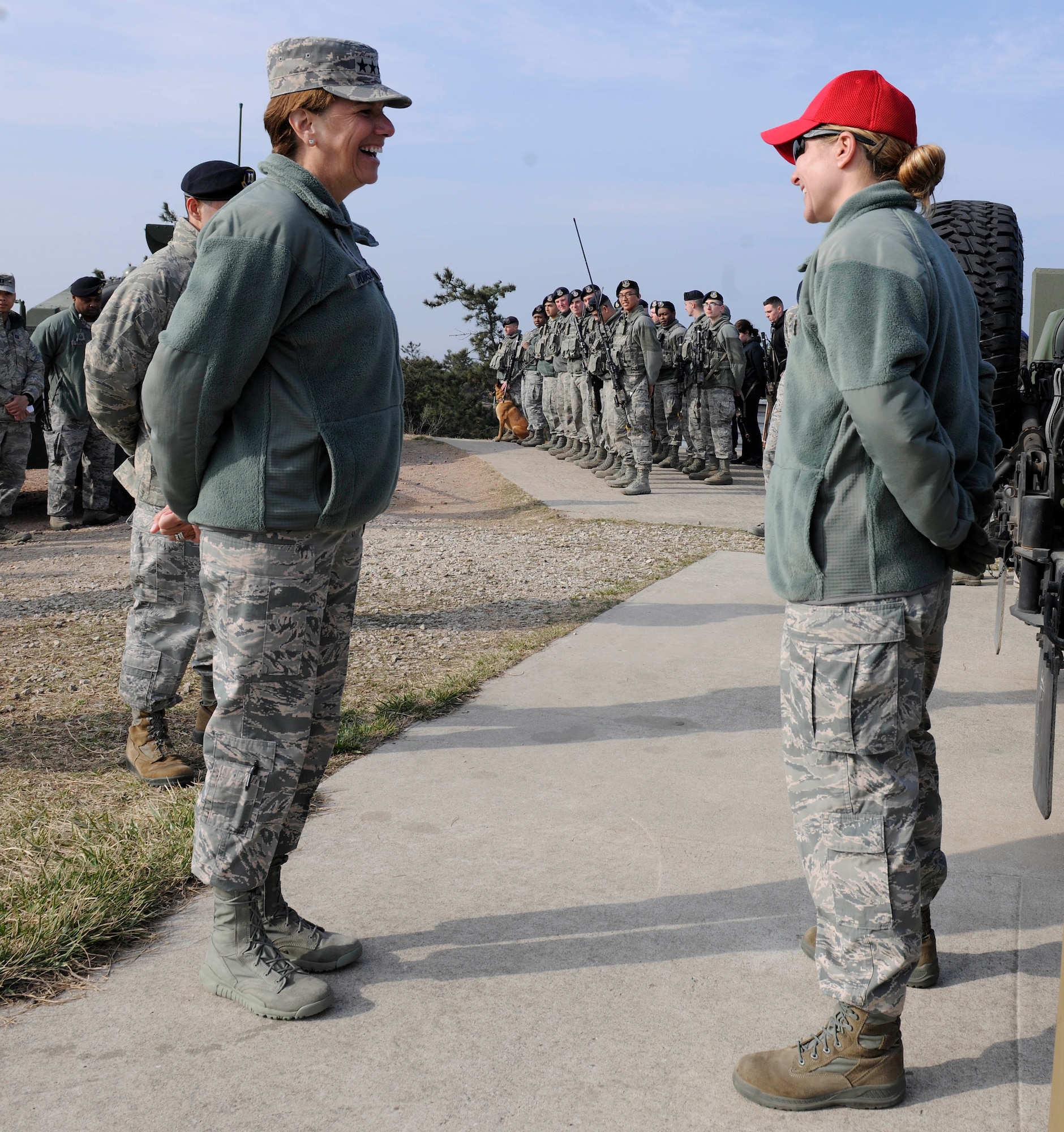 Gen. Lori J. Robinson, Pacific Air Forces commander, receives a briefing from a 8th Security Forces Squadron combat arms instructor during her visit to Kunsan Air Base, Republic of Korea, March 17, 2016. Robinson had the opportunity to see firsthand how Kunsan Airmen contribute to deterring aggression on the Korean Peninsula during her visit.