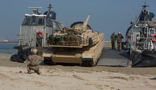 Cpl. Henry Estrada, a gunner with 1st Tank Battalion from Lewisville, Texas, guides an M1A1 Abrams Main Battle Tank off a Landing Craft Air Cushion during rail operations at Dogu Beach, Republic of Korea, March 15, 2016, as part of Exercise Ssang Yong 16. Ssang Yong 16 is a biennial combined amphibious exercise conducted by forward-deployed U.S. forces with the Republic of Korea Navy and Marine Corps, Australian Army and Royal New Zealand Army Forces in order to strengthen our interoperability and working relationships across a wide range of military operations - from disaster relief to complex expeditionary operations.