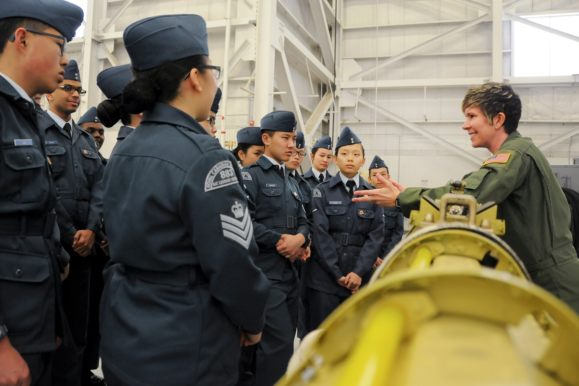 Technical Sgt. Erica Knight, 756th Air Refueling Squadron boom operator, showcases 459th Air Refueling Wing missions to a squadron of Royal Canadian Air Cadets inside a hangar on the Joint Base Andrews, Md., flight line March 15, 2016. The tour group observed the inner workings of a KC-135R Stratotanker engine, boom arm and cargo area as well as discussed life as a U.S. Air Force Reserve member with citizen Airmen. (U.S. Air Force photo/Staff Sgt. Kat Justen)  
