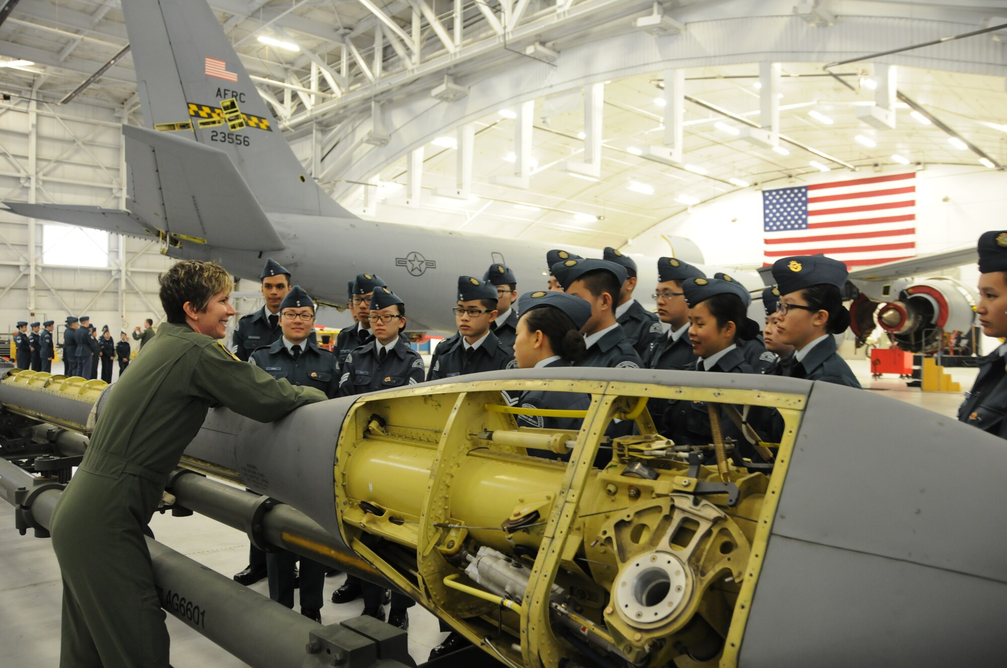 Technical Sgt. Erica Knight, 756th Air Refueling Squadron boom operator, showcases 459th Air Refueling Wing missions to a squadron of Royal Canadian Air Cadets inside a hangar on the Joint Base Andrews, Md., flight line March 15, 2016. The tour group observed the inner workings of a KC-135R Stratotanker engine, boom arm and cargo area as well as discussed life as a U.S. Air Force Reserve member with citizen Airmen. (U.S. Air Force photo/Staff Sgt. Kat Justen)  
