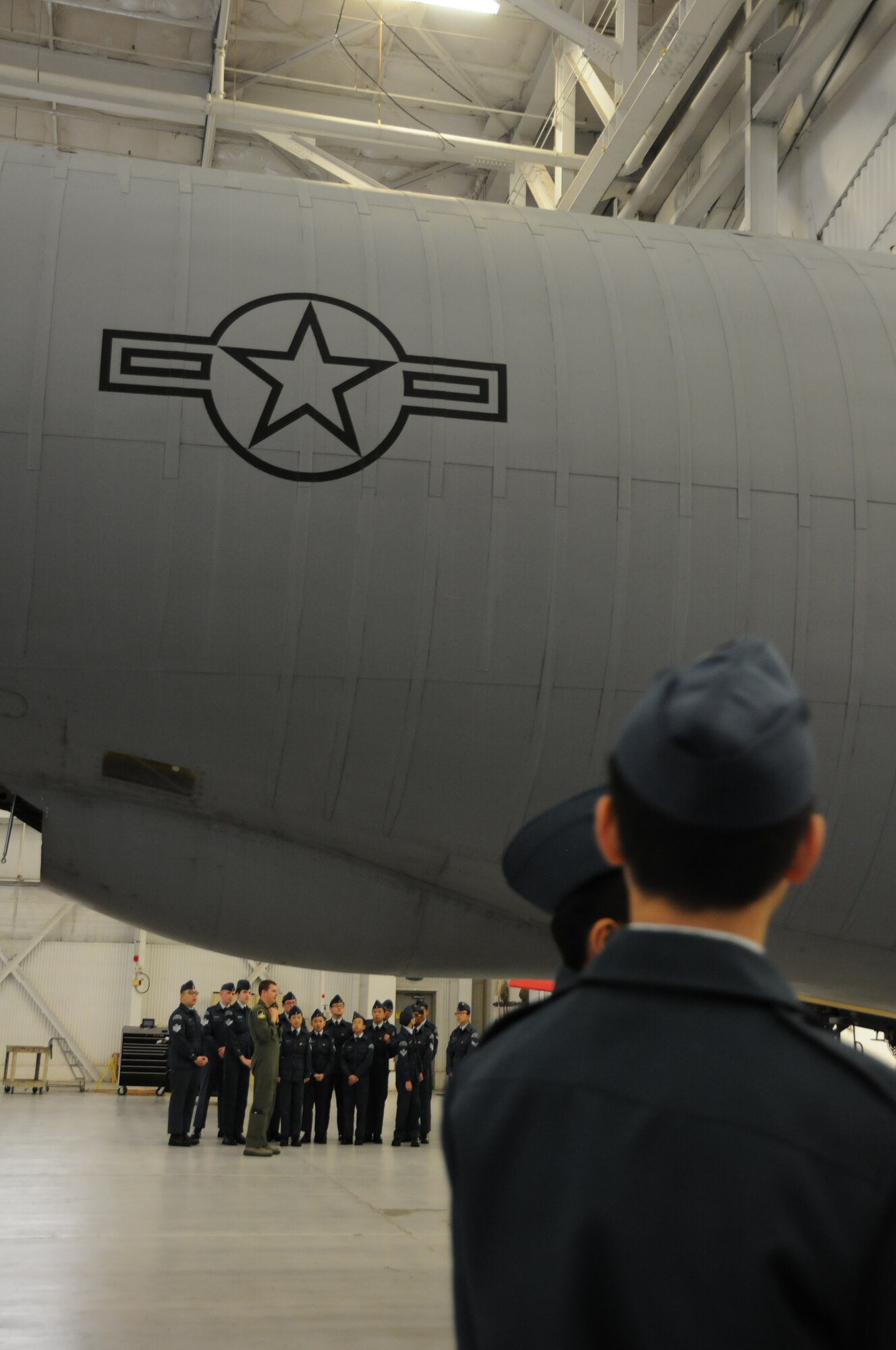 First Lt. Kyle Swenson, 756th Air Refueling Squadron pilot, showcases 459th Air Refueling Wing missions to a squadron of Royal Canadian Air Cadets inside a hangar on the Joint Base Andrews, Md., flight line March 15, 2016. The tour group observed the inner workings of a KC-135R Stratotanker engine, boom arm and cargo area as well as discussed life as a U.S. Air Force Reserve member with citizen Airmen. (U.S. Air Force photo/Staff Sgt. Kat Justen)  