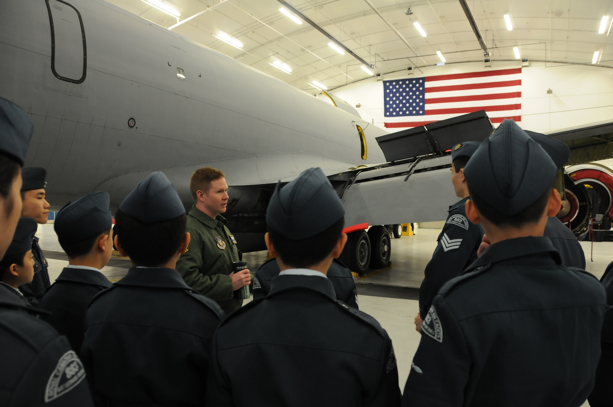 First Lt. Grant Colburn, 756th Air Refueling Squadron pilot, showcases 459th Air Refueling Wing missions to a squadron of Royal Canadian Air Cadets inside a hangar on the Joint Base Andrews, Md., flight line March 15, 2016. The tour group observed the inner workings of a KC-135R Stratotanker engine, boom arm and cargo area as well as discussed life as a U.S. Air Force Reserve member with citizen Airmen. (U.S. Air Force photo/Staff Sgt. Kat Justen)  