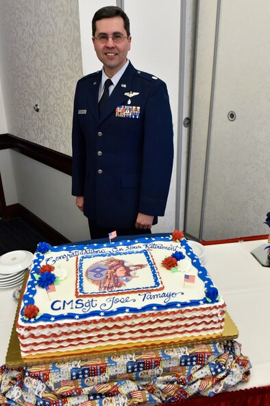 Lt. Col. Paul Kowalczyk, 932nd Aeromedical Evacuation Squadron, brought a special multi-layered cake to the base for the retirement ceremony of Chief Master Sgt. Jose Tamayo, one made sweeter because it was produced by the colonel's brother, Christopher Kowalcyzk, five hours away near Chicago at Central Continental Bakery, technically in Mount Prospect.  Like many in the unit saying farewell to Chief Tamayo, it was bittersweet for Colonel Kowalczyk because of all the great times they had spent together over the year in the 932nd Aeromedical Evacuation Squadron.  The hardest part was driving down from Chicago area with this beautiful cake and not hitting any potholes, laughed Kowalczyk.  (U.S. Air Force photo by Tech. Sgt. Christopher Parr)