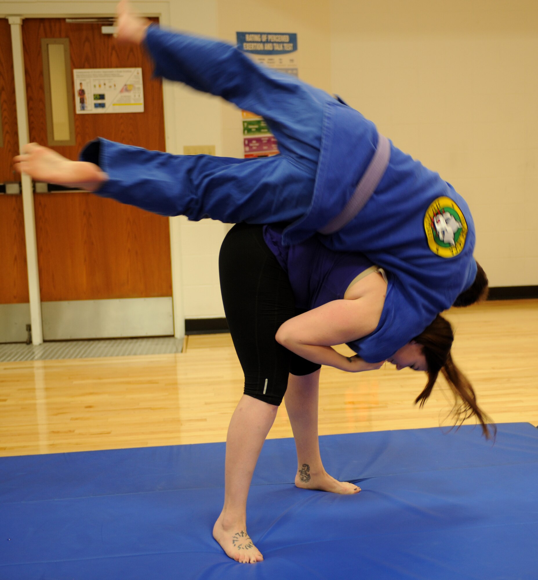Samantha Scudmore, 28th Medical Support Squadron call center manager, performs a hip throw during a women’s self-defense training seminar at Ellsworth Air Force Base, S.D., March 14, 2016. Brazilian jiu-jitsu reinforces the concept that a smaller person can successfully defend against a bigger, stronger assailant by using proper technique and leverage. (U.S. Air Force photo by Airman 1st Class Denise M. Nevins/Released)