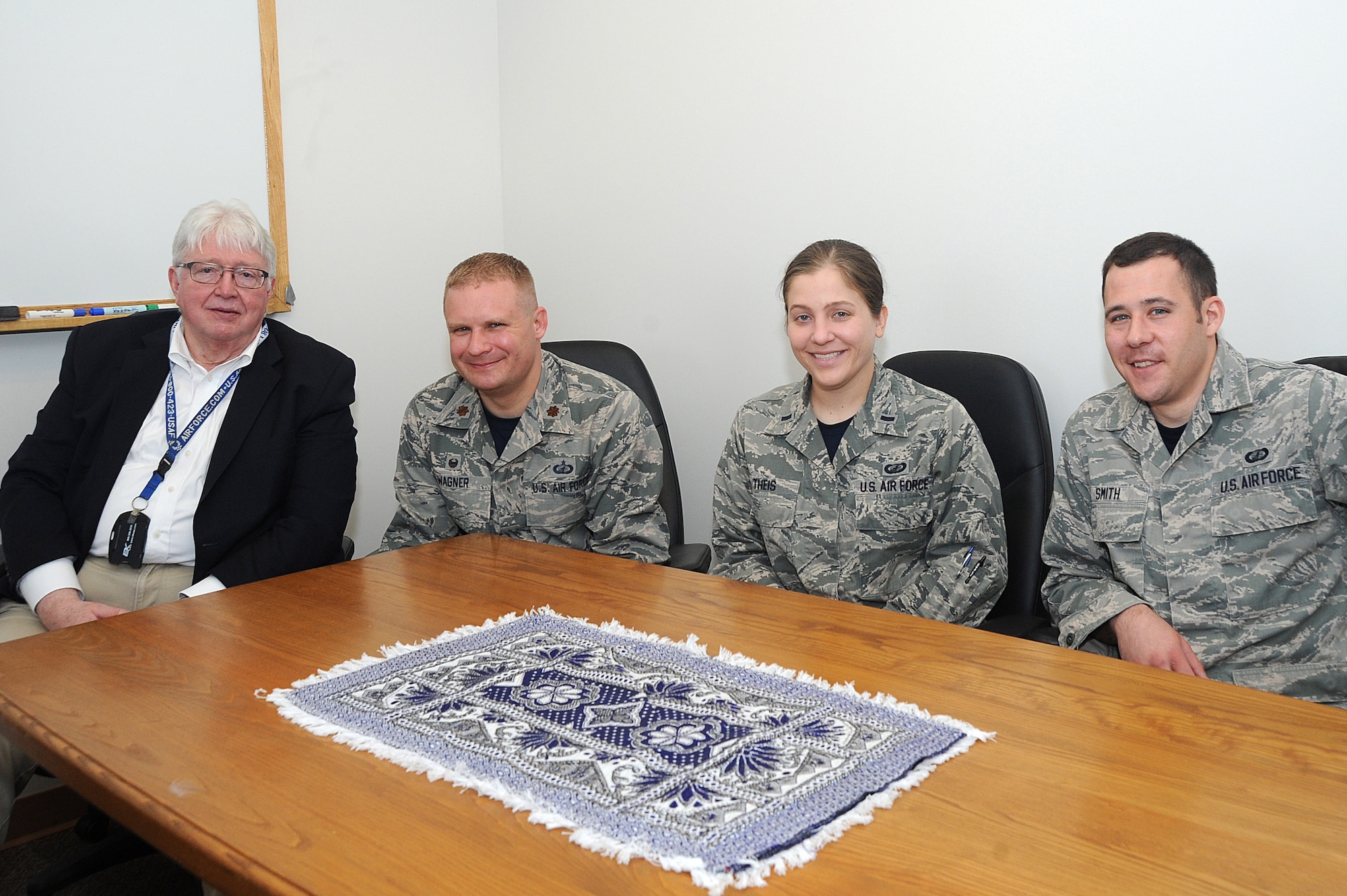 The McConnell business mentoring team poses for a photo during a lunch committee meeting, March 11, 2016, at McConnell Air Force Base, Kan. The volunteer team provides strategic business mentoring to women-owned businesses in Rwanda and Afghanistan. (U.S. Air Force photo/Airman Jenna K. Caldwell)  