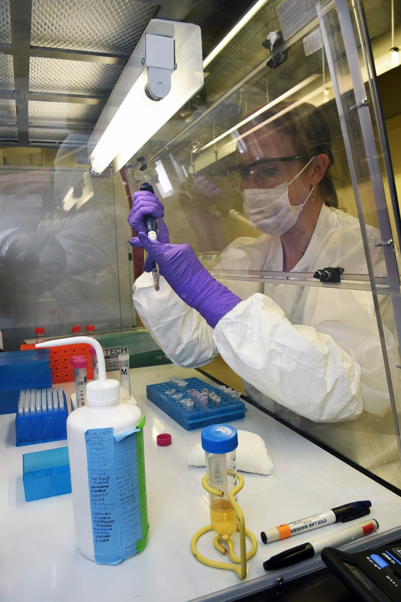 DoD DNA Registry, Armed Forces DNA Identification Laboratory (AFDIL) DNA Analyst, Holly Krantz, extracts mtDNA using filter columns to remove impurities. AFDIL, which is part of the Armed Forces Medical Examiner System (AFMES) at Dover AFB, Del., is working with the newest innovation in Forensic DNA science, Mitochondrial DNA (mtDNA) Hybridization Capture and Next Generation DNA Sequencing (NGS). (U.S. Navy photo by Mass Communication Specialist 2nd Class Samantha Thorpe)