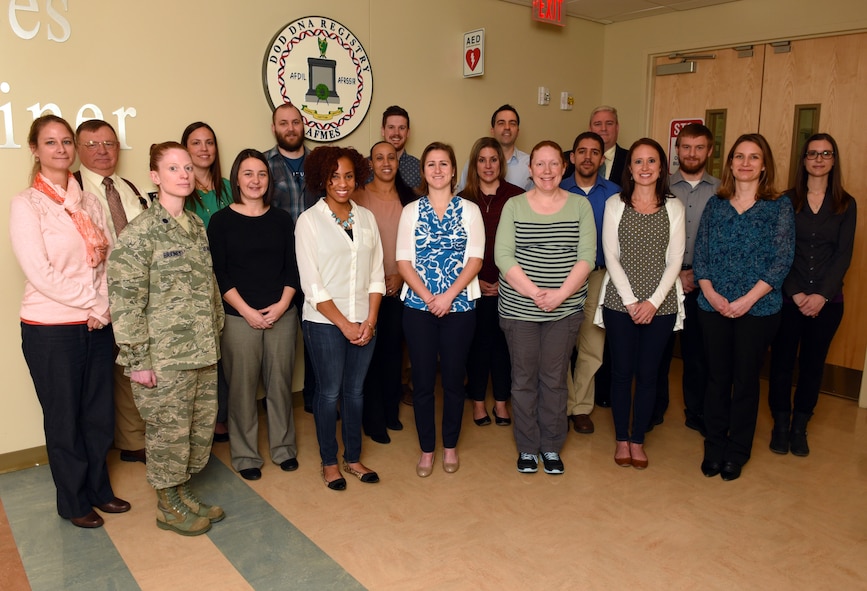 From left to right (Back row) Suzanne Barritt-Ross, James Canik, Christina Neal, Daniel Kahline, Joseph Ring, Sean Oliver, (Middle Row) Jennifer Higganbotham, Erin Gorden, Eric Ramirez, Aaron Fox, Jacqueline Thomas, (Front row) Lt. Col.  Alice Briones, Kimberly Andreaggi, Bruche Trotter, Michelle Peck, Megan Poffenberger, Holly Krantz, Dr. Charla Marshall and Dr. Timothy McMahon, all members of the DoD DNA Registry, Armed Forces DNA Identification Laboratory (AFDIL) Next Generation DNA Sequencing (NGS) team, pose for a group picture. AFDIL, which is part of the Armed Forces Medical Examiner System (AFMES) at Dover AFB, Del., is working with the newest innovation in Forensic DNA science, Mitochondrial DNA (mtDNA) Hybridization Capture and NGS. (U.S. Navy photo by Mass Communication Specialist 2nd Class Samantha Thorpe)