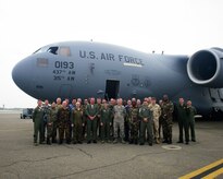 Maj. Gen. Vincent Mancuso, mobilization advisor to CSAF, Air Staff, HQ, poses for a group photo with international air attachés and C-17 Globemaster III crewmembers March 17, 2016, on the flightline at Joint Base Charleston – Air Base, S.C. The attachés were invited by Air Force chief of staff Gen. Mark A Welsh III to participate in a spring tour that gave them a firsthand look into JB Charleston's mission capabilities. (U.S. Air Force photo/Senior Airman Clayton Cupit) 

