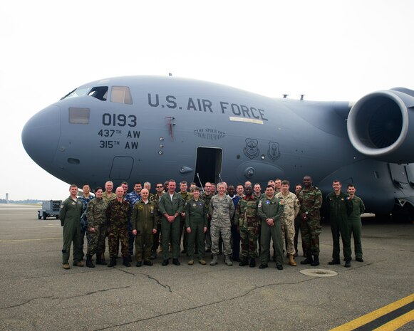 Maj. Gen. Vincent Mancuso, Mobilization Advisor to CSAF, Air Staff, HQ, poses for a group photo with National Air Attaché  and C-17 Globemaster III crewmembers ¬¬¬March 17, 2016, on the flightline at Joint Base Charleston – Air Base, S.C. The Attaché were invited by Air Force chief of staff Gen. Mark A Welsh III to participate in a spring tour that gave them a firsthand look into JB Charleston and our mission capabilities. (U.S. Air Force photo/Senior Airman Clayton Cupit)