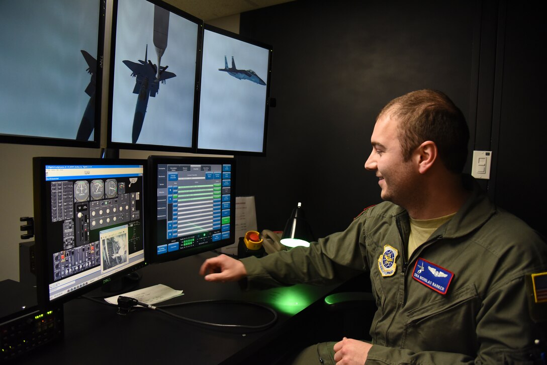 Senior Airman Nicholas Barker, 92nd Operations Group boom operator, demonstrates the 92nd OG’s boom simulator to a group of Comcast NBCUniversal executives during a base tour March 16, 2016, at Fairchild Air Force Base, Wash. The tour provided beneficial information to the group and gave them a better understanding of the military and how the Airmen of Fairchild extend the global reach of the Air Force’s mission. (U.S. Air Force photo/Airman 1st Class Mackenzie Richardson)