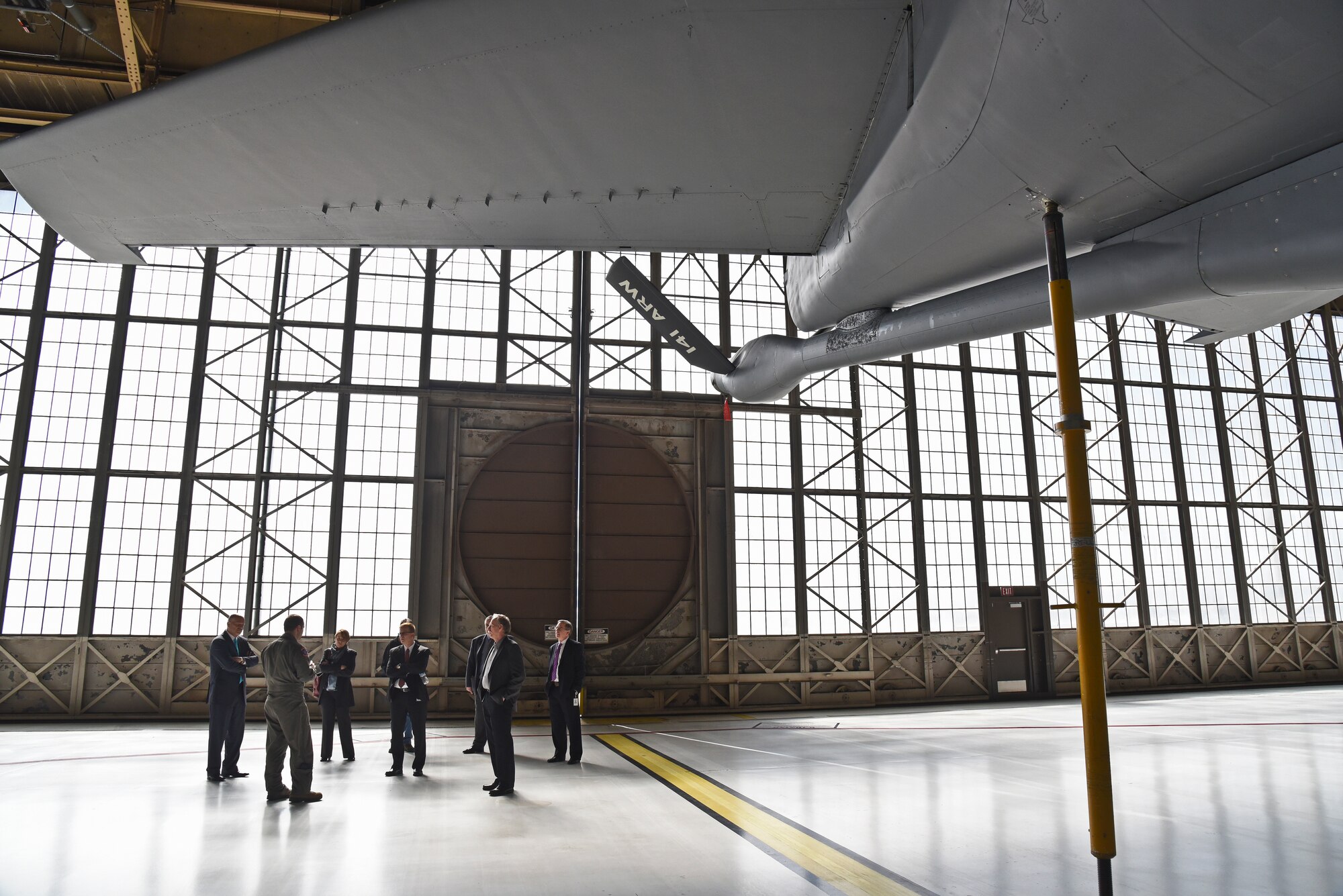 Senior Airman Nicholas Barker, 92nd Operations Group boom operator, explains the ins-and-outs of the KC-135 Stratotanker and Fairchild’s air-refueling mission to a group of Comcast NBCUniversal executives during a base tour March 16, 2016, at Fairchild Air Force Base, Wash. The tour was held in conjunction with the inauguration of Comcast’s new Veterans Employee Resource Group located at the new Comcast Call Center in Spokane Valley, Wash. (U.S. Air Force photo/Airman 1st Class Mackenzie Richardson)