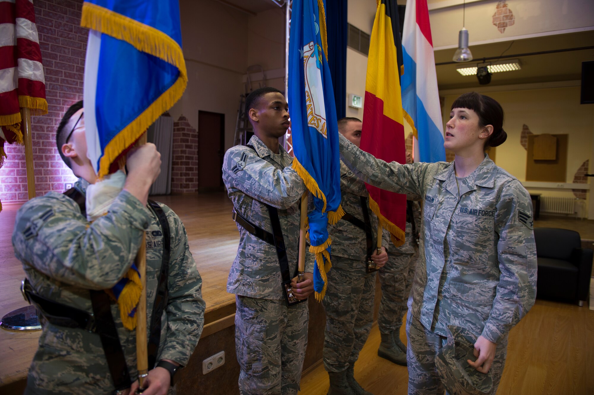 U.S. Air Force Senior Airman Amber Marcum, U.S. Air Force Honor Guard base honor guard program coordinator, instructs the Spangdahlem Air Base honor guard on flag details during training at Spangdahlem Air Base, Germany, March 16, 2016. The USAF Honor Guard spent a day honing the skills of the Spangdahlem honor guardmen at the request of the base. (U.S. Air Force photo by Staff Sgt. Christopher Ruano/Released) 