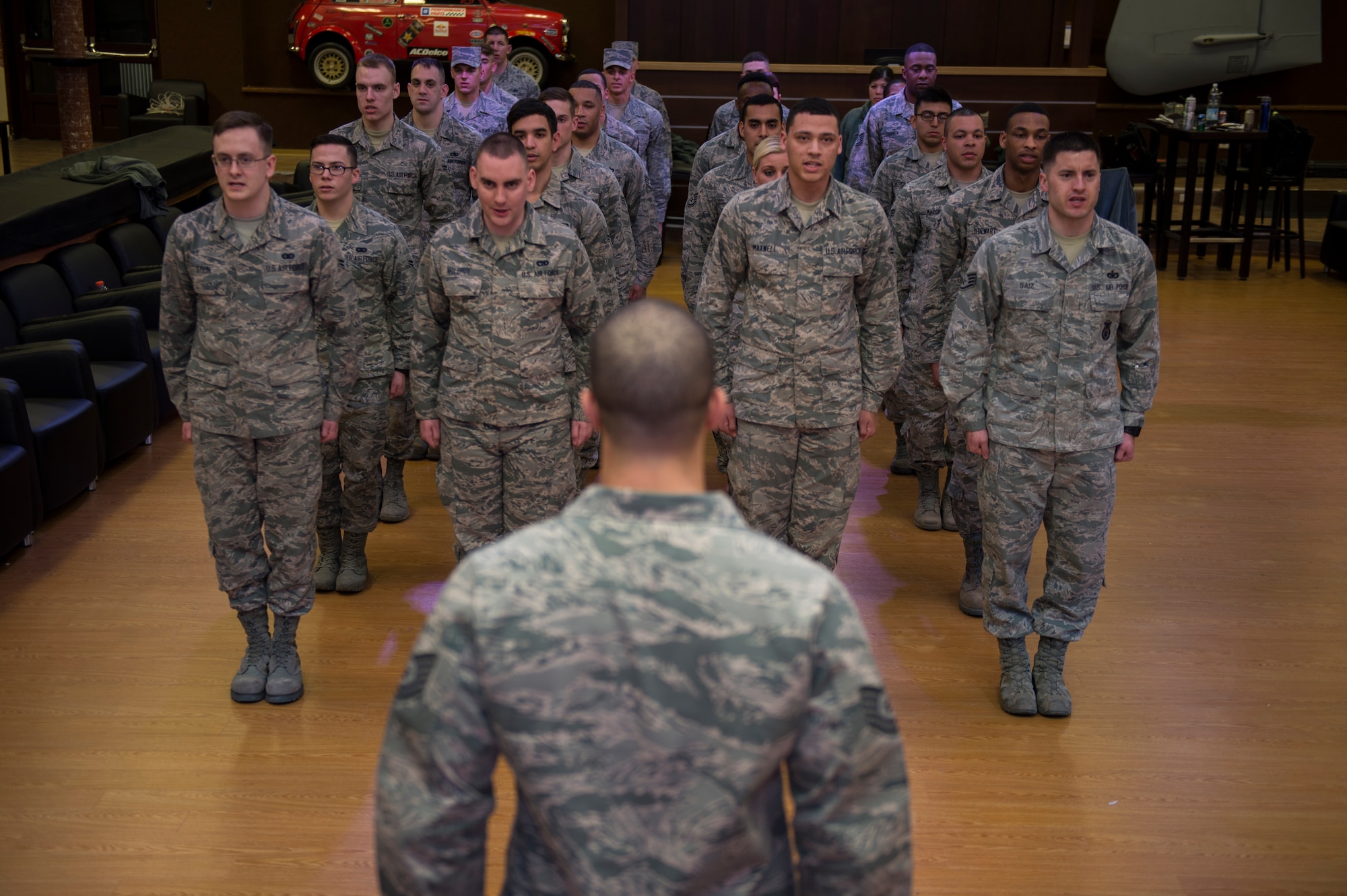 Members of the Spangdahlem Air Base honor guard and U.S. Air Force Honor Guard recite the honor Guard creed in formation during training at Spangdahlem Air Base, Germany, March 16, 2016. The Base Honor Guard Training Program standardizes ceremonies and the manner in which they are performed from base to base. (U.S. Air Force photo by Staff Sgt. Christopher Ruano/Released) 
