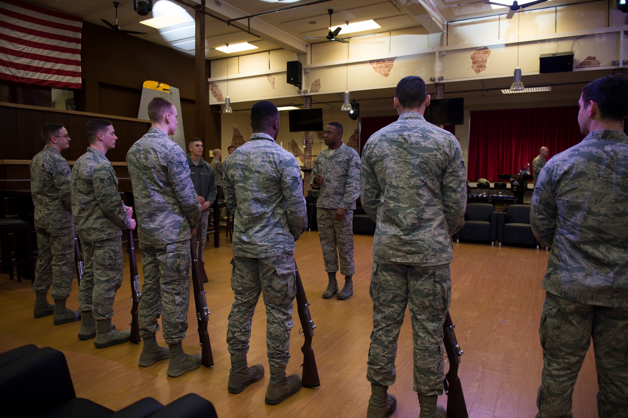 U.S. Air Force Tech. Sgt. Maurice Chaney, U.S. Air Force Honor Guard drill team NCO in charge, leads base honor guard members in rifle drills during training at Spangdahlem Air Base, Germany, March 16, 2016. The honor guard firing party fires a succession of shots at military funerals to honor a deceased veteran. (U.S. Air Force photo by Staff Sgt. Christopher Ruano/Released)  
