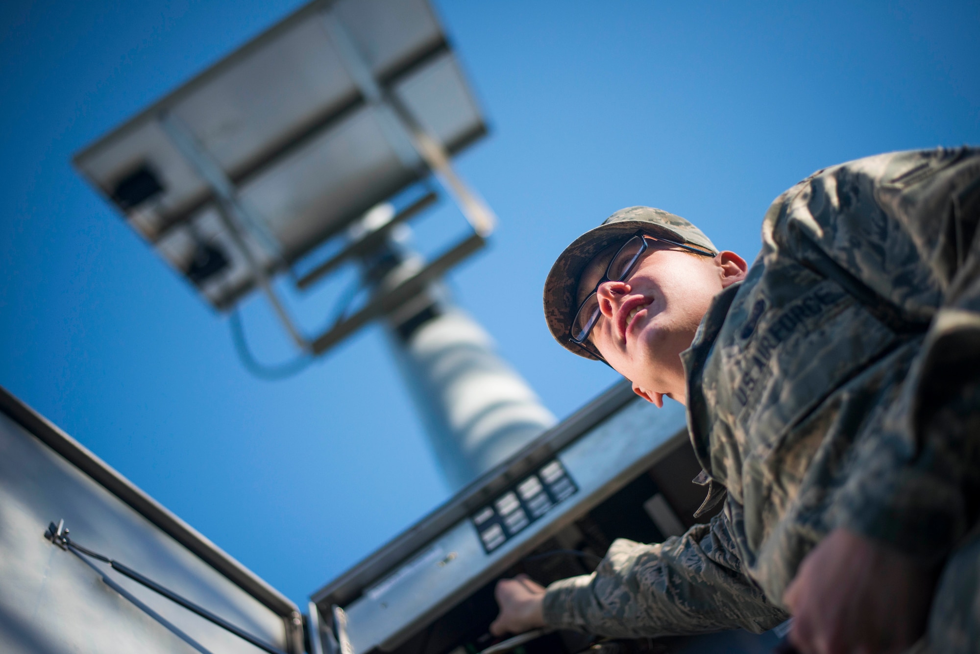 Airman 1st Class Jason Geiger, 744th Communications Squadron radio frequency transmissions technician, inspects the base notification system giant voice at Joint Base Andrews, Md., March 17, 2016. RF transmission technicians conduct routine inspections to ensure equipment is properly maintained. (U.S. Air Force by Staff Sgt. Chad C. Strohmeyer/Released)