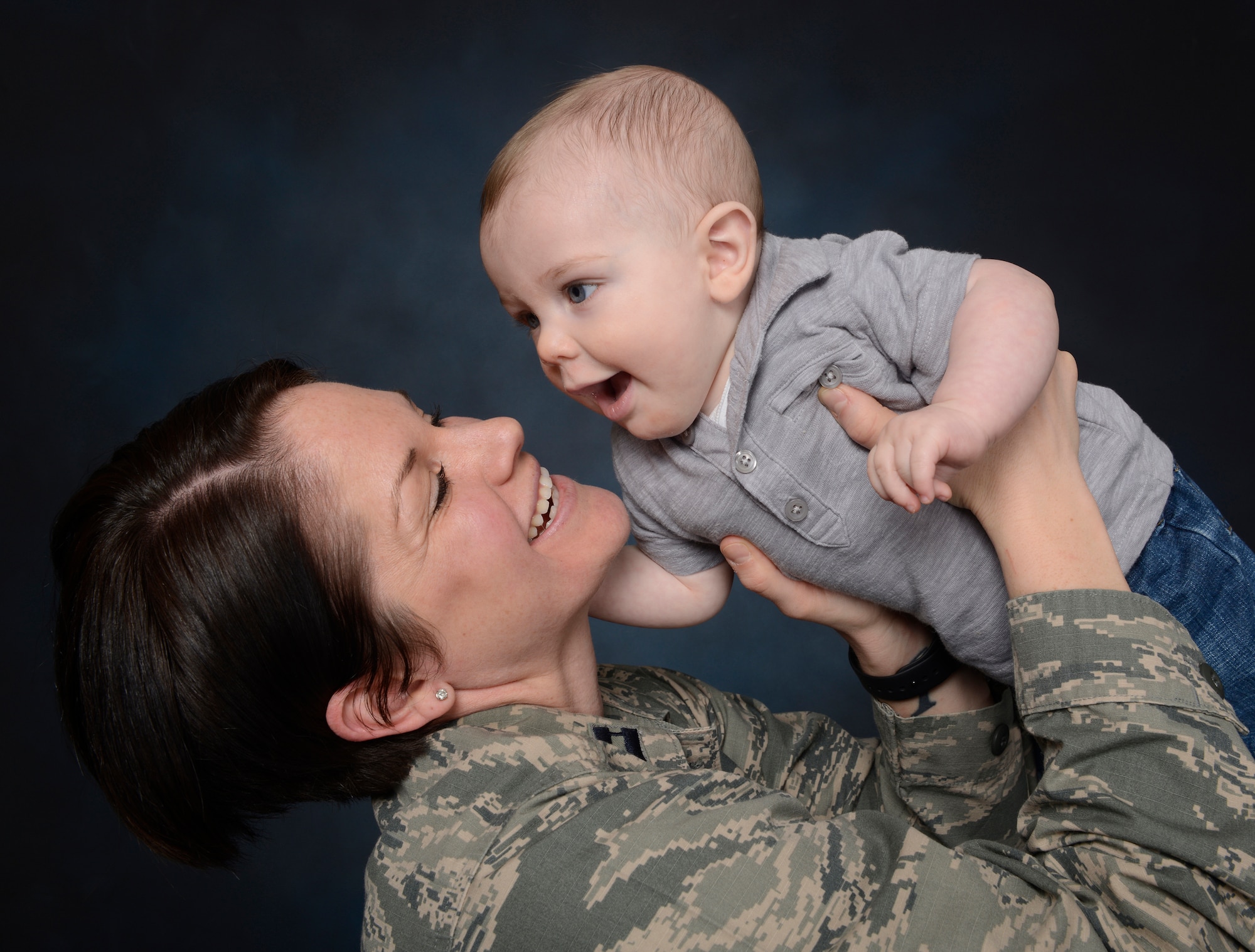 Capt. Morgan McNabb, 341st Medical Operations Squadron family advocacy officer, poses with son, Dominic. Air Force Instruction 44-102, “Medical Care Management,” was revised in 2012 to include a breast-feeding policy recommending arrangement of work schedules that allow 15-30 minute breaks, every three to four hours in an area providing adequate privacy and cleanliness, excluding restrooms. (U.S. Air Force photo/Beau Wade)