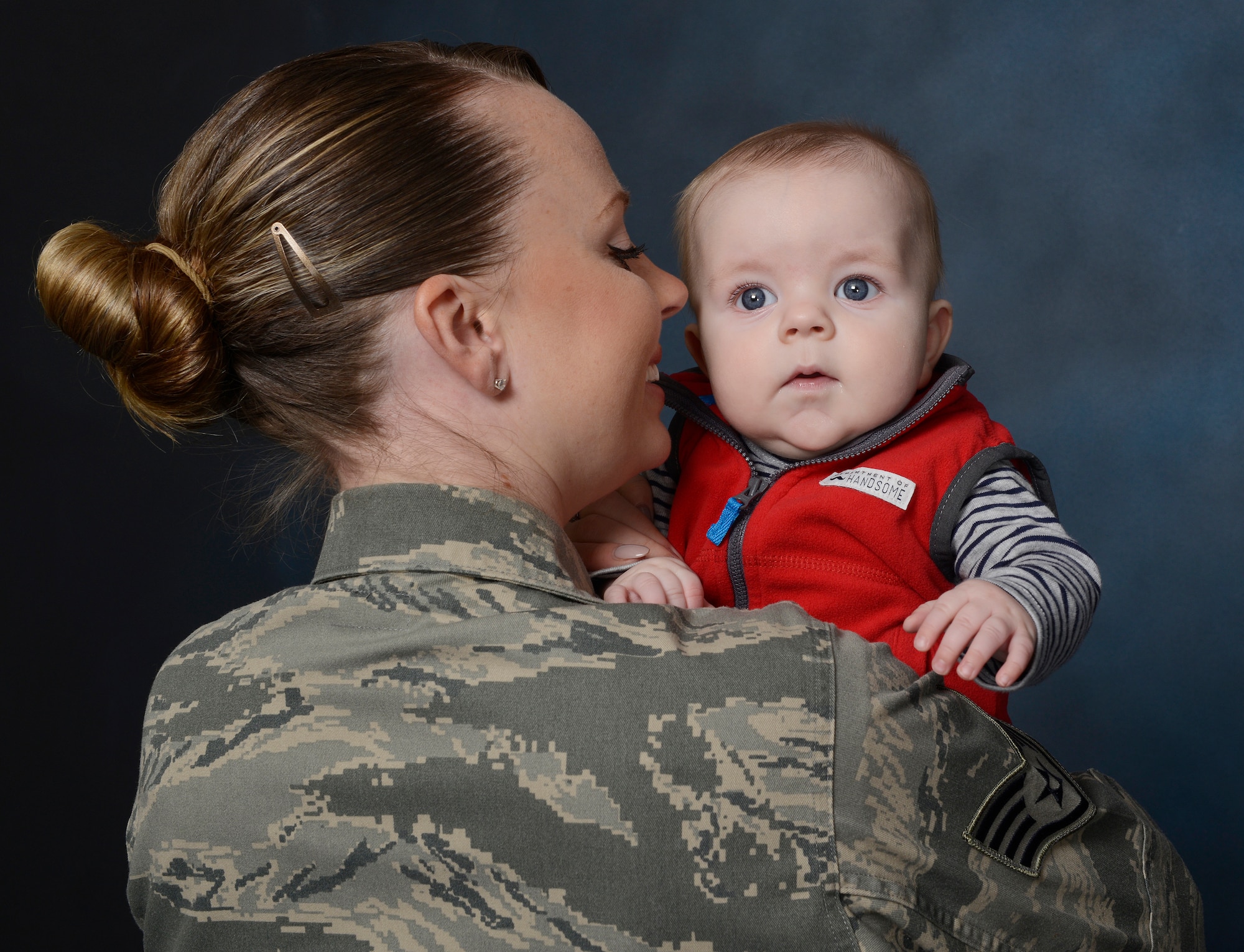 Staff Sgt. Leslie Baccus, 341st Medical Support Squadron, NCO in charge of laboratory shipping, and son, William, pose together. In 2015, women in the Air Force were authorized one year from the birth of a child to be exempt from deployments and return to physical fitness standards.  This year the Pentagon set maternity leave to 12 weeks across the Department of Defense. (U.S. Air Force photo/Staff Sgt. Delia Marchick)