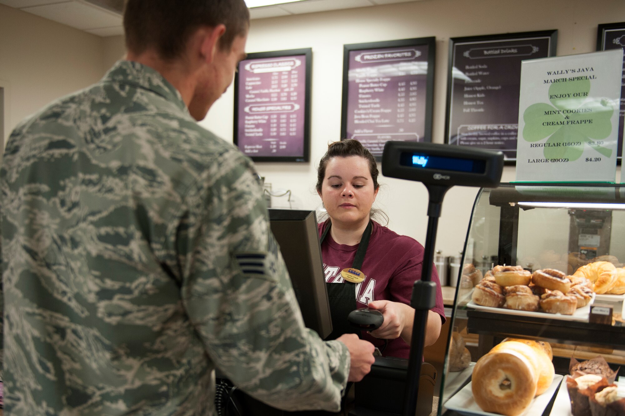 Crystal Cheff, a 19th Force Support Squadron Wally’s Java barista, scans Senior Airman Colton Carrier’s, 19th Communication Squadron client systems technician, military ID, Mar. 16, 2016, at Little Rock Air Force Base, Ark. Airmen on the meal card now are able to get all of the items on the Wally’s Java Menu by paying with their military ID. (U.S. Air Force photo by Airman 1st Class Mercedes Taylor) 