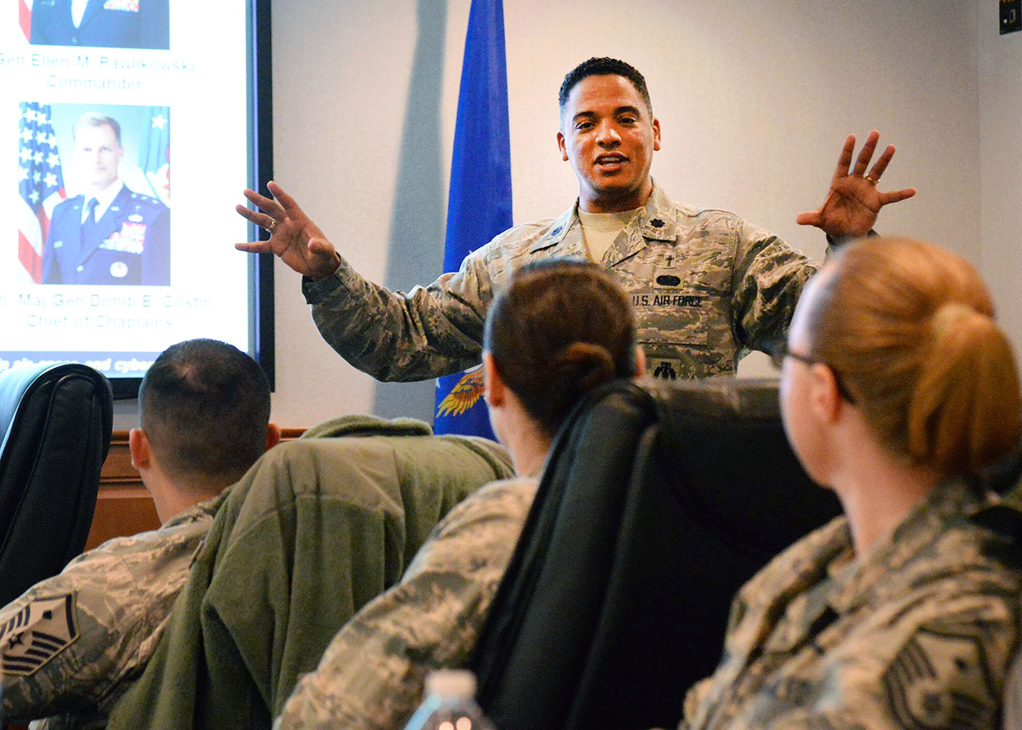 Air Force Materiel Command Chaplain (Lt. Col.) Shon Neyland, left, speaks to members of the Hanscom community during a Developing Resilient Leaders presentation in Building 1614 March 15. As part of his presentation, Neyland addressed spiritual care for Hanscom's civilian Airmen and religious accommodation. (U.S. Air Force photo by Linda LaBonte Britt)