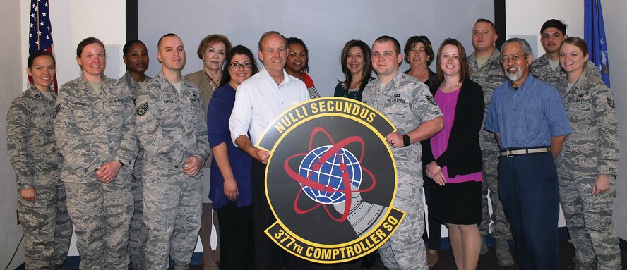 The Financial Analysis Flight, shown here, of the 377th Comptroller Squadron has been named the best in the Air Force for 2015. Ryan Goodpastor, not shown, is the final member of the flight. (Courtesy photo)