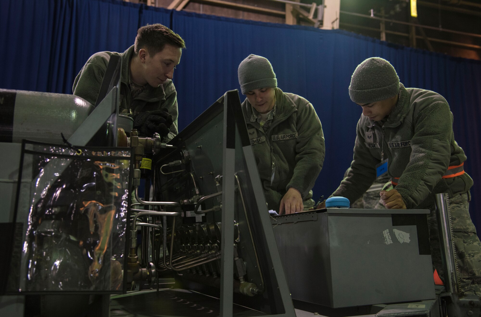 Cargo deployment function Airmen calculate the weight of cargo at Misawa Air Base, Japan, March 15, 2016. Shipments are appropriately proportioned for transport aircraft through the use of measuring tapes, scales and calculations. (U.S. Air Force photo by Airman 1st Class Jordyn Fetter)