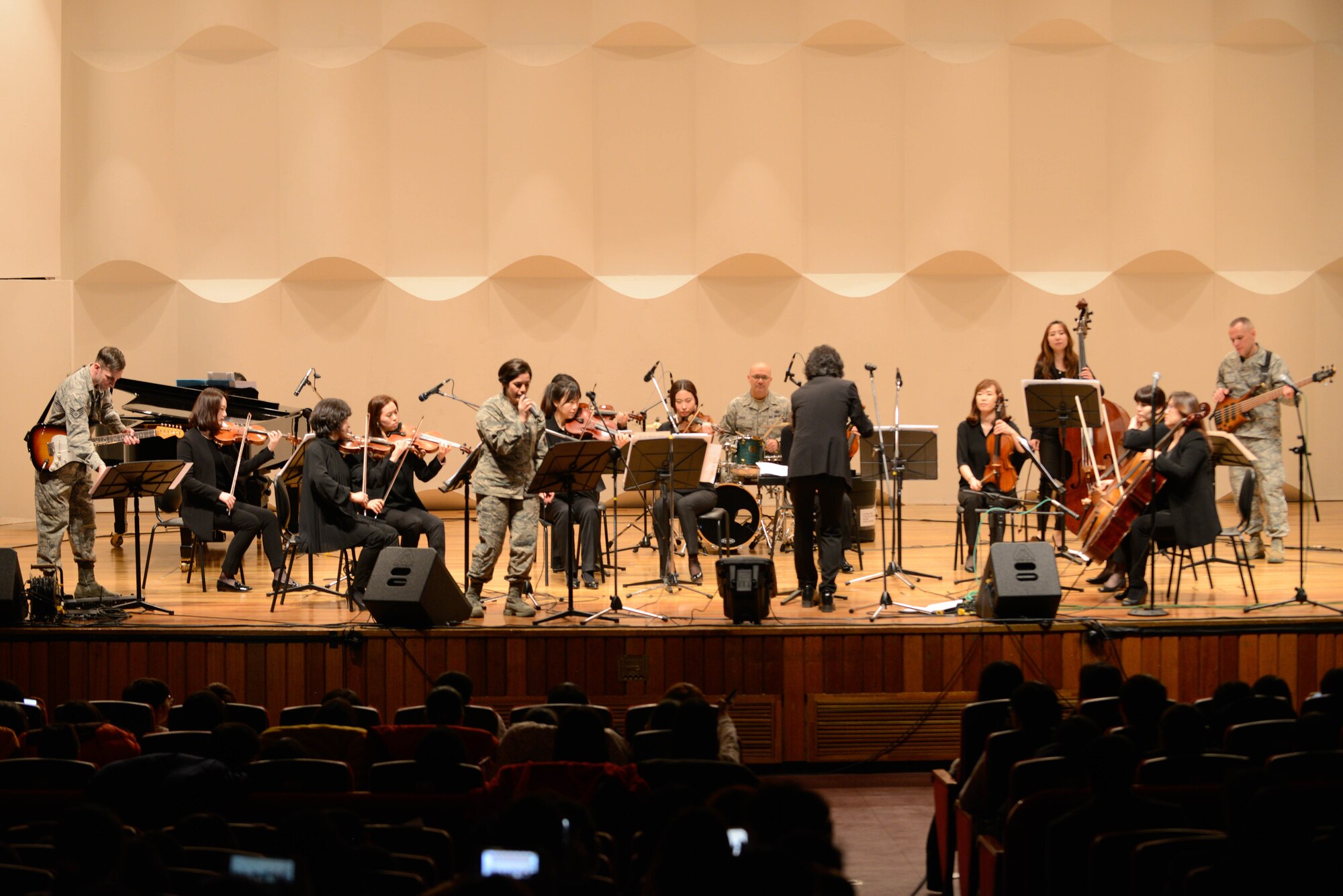 The U.S. Air Force Band of the Pacific-Asia ensemble Pacific Trends and Pyeongtaek Orchestra perform a concert for Korean children and families March 10, 2016, in Pyeongtaek, Republic of Korea. The PACAF Band consists of full-time active duty musicians performing in the Western Pacific region in support of military and community relations objectives. (U.S. Air Force photo by Airman 1st Class Dillian Bamman/Released)