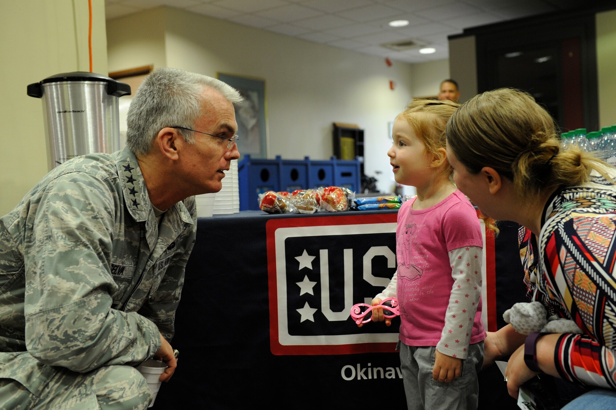 U.S. Air Force Gen. Paul Selva, Vice Chairman of the Joint Chiefs of Staff, greets Olivia Jackson, 3, and her mother Sara during a meet and greet at the Schilling Community Center March 14, 2016, at Kadena Air Base, Japan. Selva led a United Service Organizations Spring Visit tour with celebrity guests Betty Cantrell, Anthony Pettis, Donald Cerrone, Craig Morgan and Charles Tillman as part of the USO 75th Anniversary celebration. (U.S. Air Force photo by Senior Airman Peter Reft)