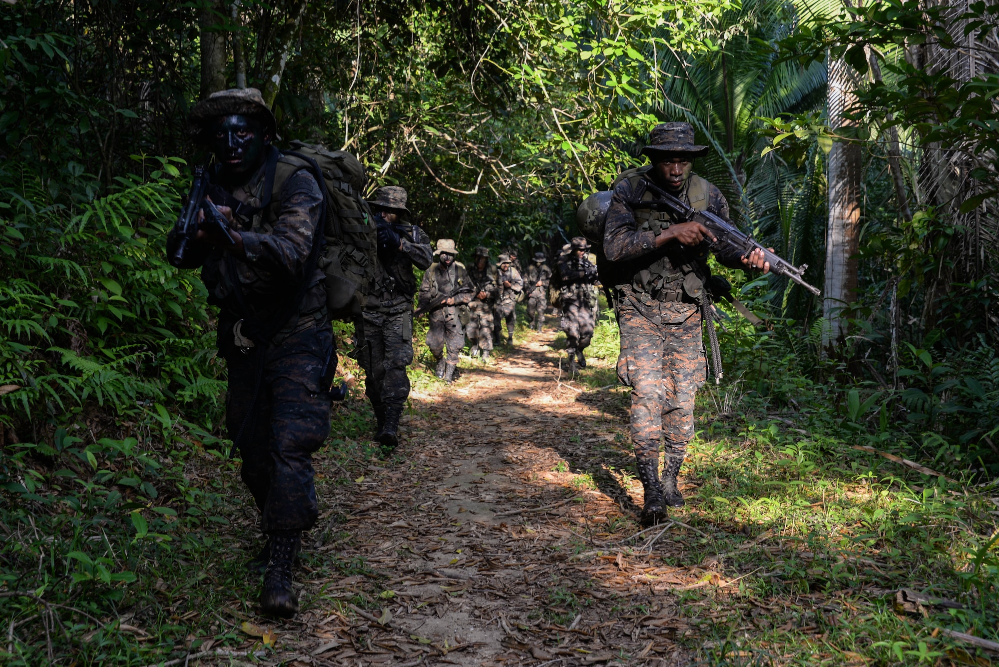 Guatemalan marines participate in a training march, March 9, 2016, Guatemala, as a part of four-week course provided by a U.S. Marine Security Cooperation Team. The Guatemalan marines participated in various physical and planning training activities geared toward urban operations to help them more effectively counter drug trafficking operations in the area. (U.S. Air Force photo by Staff Sgt. Westin Warburton/RELEASED)