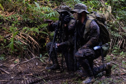 Guatemalan marines navigate to their training target March 9, 2016, Guatemala, during a four-week course meant to hone squad level movements. The Guatemalan marines completed a final exercise before their graduation, partnering with subject matter experts from a U.S. Marine Security Cooperation Team. (U.S. Air Force photo by Staff Sgt. Westin Warburton/RELEASED)