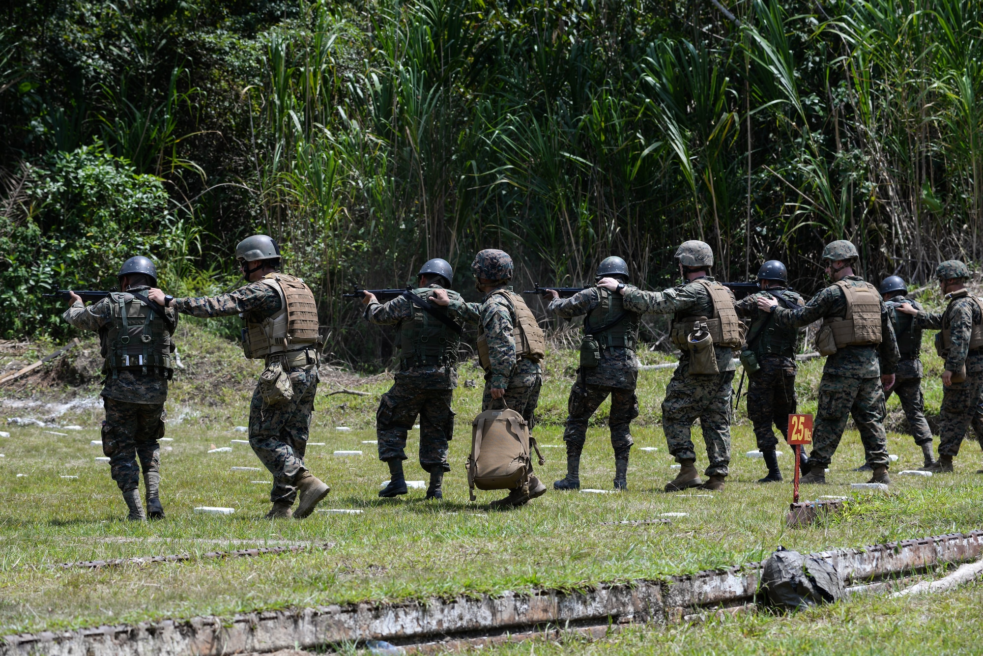 U.S. Marines supervise Guatemalan marines firing at targets March 10, 2016, Guatemala, during a live-fire exercise. The Guatemalan marines took part in a four week training course to hone their skills in basic infantry movements and urban operations with the intent of helping them combat drug trafficking organizations. (U.S. Air Force photo by Staff Sgt. Westin Warburton/RELEASED)