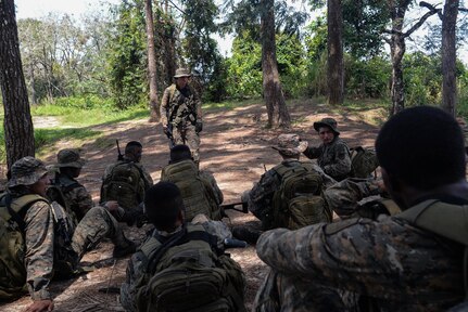 Guatemalan marines conduct a brief March 9, 2016, Guatemala, as part of an exercise which tested their ability to navigate to an objective and operate in an urban environment. The exercise was a final evaluation in course requested by the Guatemalans to provide training and real-life simulations for the Guatemalans marines. (U.S. Air Force photo by Staff Sgt. Westin Warburton/RELEASED)