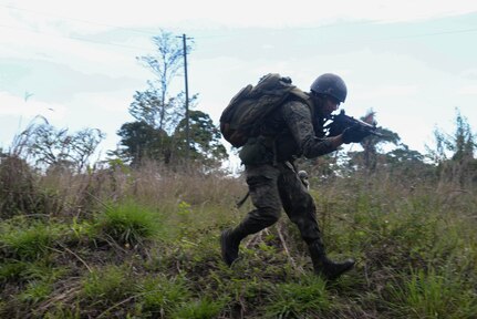 A Guatemalan marine runs March 9, 2016, Guatemala during a final squad-level training exercise. The Guatemalan marines participated in various exercises before graduating a four-week training course their U.S. Marine partners instructed to help evaluate best practices for small team movement and engagement. (U.S. Air Force photo by Staff Sgt. Westin Warburton/RELEASED)