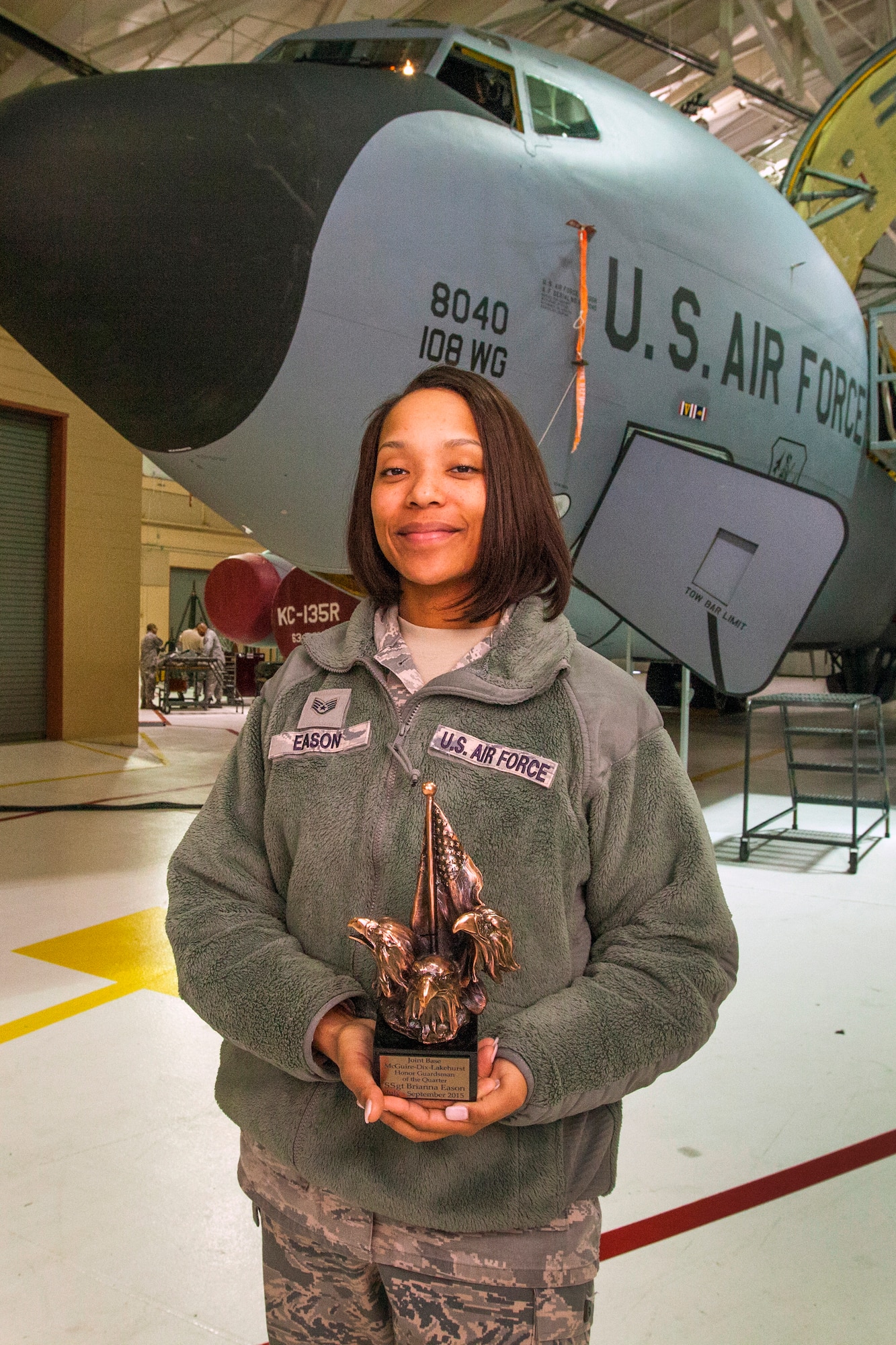Staff Sgt. Brianna M. Eason, an orderly room clerk with the 108th Wing Maintenance Operations Flight, New Jersey Air National Guard, poses with Joint Base McGuire-Dix-Lakehurst Honor Guardsman of the Quarter, July – September 2015 trophy in front of a 108th Wing KC-135R Stratotanker at Joint Base McGuire-Dix-Lakehurst, N.J., March 14, 2016. Eason was chosen as the 87th Air Base Wing Honor Guard Member of the Year for January 2015 to December 2015. Eason serves as the Non-Commissioned Officer in Charge of training for the 87th ABW Honor Guard. (U.S. Air National Guard photo by Master Sgt. Mark C. Olsen/Released)