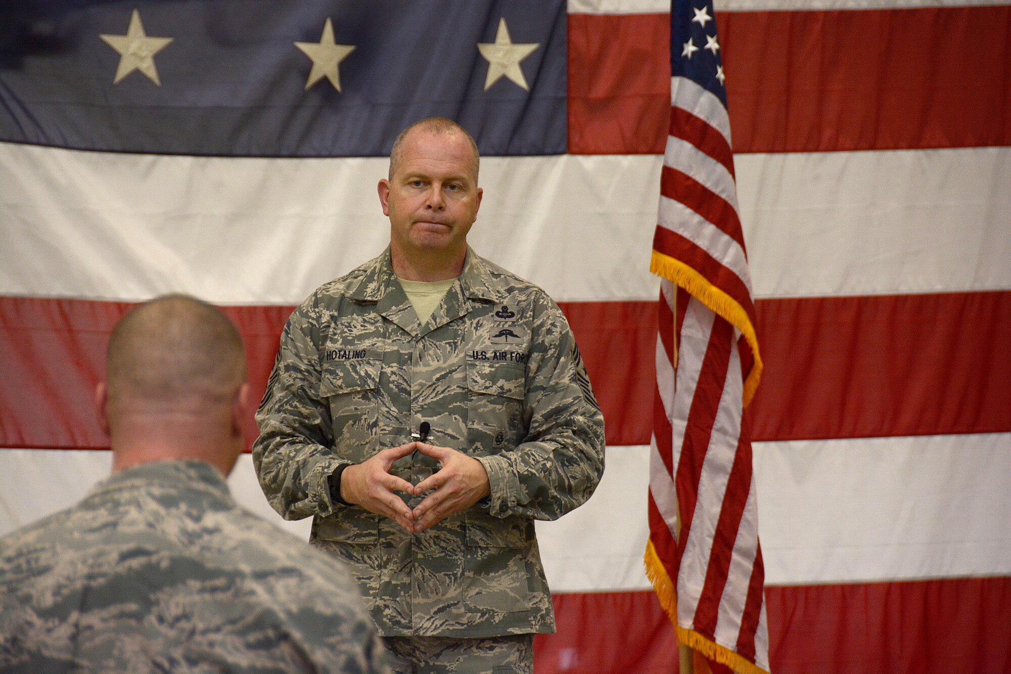 U.S. Air Force Command Chief Master Sergeant of the Air National Guard James W. Hotaling responds to a question asked by Tech. Sgt. Daniel Hatley, 145th Maintenance Squadron hydraulics technician, as well as other Airmen of the 145th Airlift Wing's junior and senior enlisted core during an “all call” held at the North Carolina Air National Guard Base, Charlotte Douglas International Airport, March 12, 2016. Airmen were given the opportunity to interact with Hotaling and ask any questions they had about the Air Force and the Air National Guard. Hotaling discussed his key focus areas that included the renewing of the commitment to the profession of arms, the health of the force, and recognizing and embracing the accomplishments of Airmen. (U.S. Air National Guard photo by Senior Airman Laura J. Montgomery/Released)