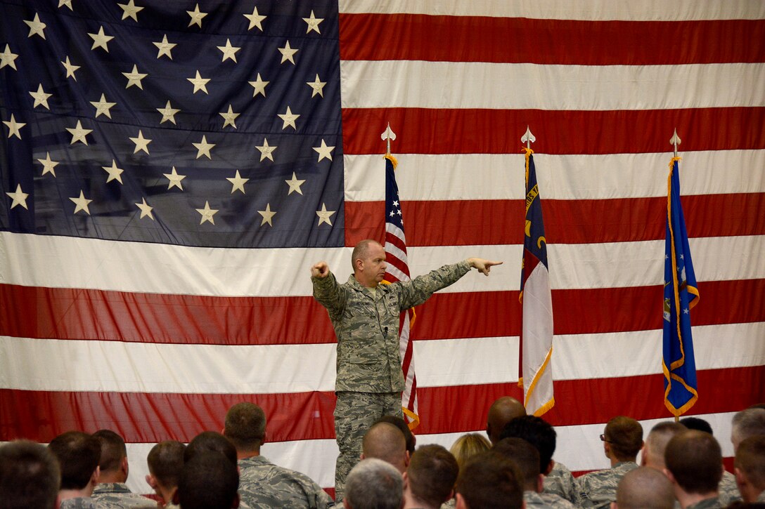 U.S. Air Force Command Chief Master Sergeant of the Air National Guard James W. Hotaling responds to a question asked by Tech. Sgt. Daniel Hatley, 145th Maintenance Squadron hydraulics technician, as well as other Airmen of the 145th Airlift Wing's junior and senior enlisted core during an “all call” held at the North Carolina Air National Guard Base, Charlotte Douglas International Airport, March 12, 2016. Airmen were given the opportunity to interact with Hotaling and ask any questions they had about the Air Force and the Air National Guard. Hotaling discussed his key focus areas that included the renewing of the commitment to the profession of arms, the health of the force, and recognizing and embracing the accomplishments of Airmen. (U.S. Air National Guard photo by Senior Airman Laura J. Montgomery/Released)