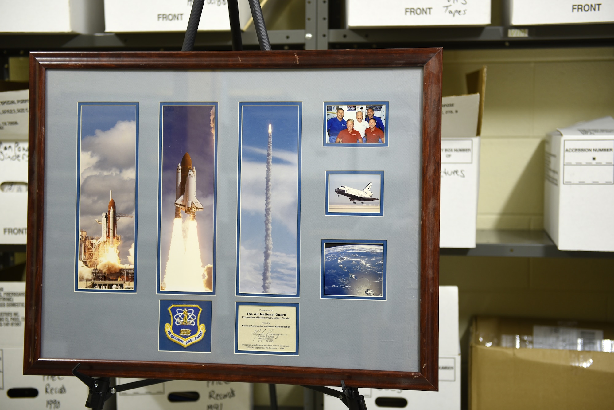 MCGHEE TYSON AIR NATIONAL GUARD BASE, Tenn. - This Air Force unit patch for the I.G. Brown Training and Education Center - now framed with a certificate of authentication signed by NASA astronaut Air Force Lt. Col. John M. Lounge - went into space for five days in 1988, aboard the Space Shuttle Discovery mission STS-26. (U.S. Air National Guard photo by Master Sgt. Mike R. Smith/Released)